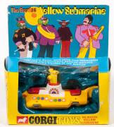 CORGI: Early 1970s &lsquo;The Beatles&rsquo; Yellow Submarine (803) &ndash; yellow and white with red hatches. Mint in original yellow and blue cardboard windowed box with original plastic packing display. Slight damage to the plastic cellophane.