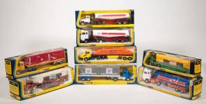 CORGI: Late 1970s to early 1980s group of large trucks including Horse Transporter Truck (1105); and, Esso Petrol Tanker with Ford Tilt Cab (1157); and, Mack Container Truck (1106). All mint in original striped cardboard windowed boxes. (8 items)