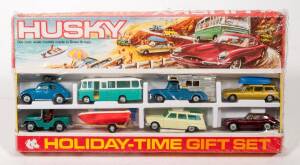 HUSKY (CORGI JUNIOR): Late 1960s Holiday Time Gift Set (3005) - comprising of Jeep with Boat on Trailer, Citroen with blue plastic Boat on Roof, Camper, Bus, Horsebox, Jaguar and Volkswagen Beetle. Mint in original red and yellow cardboard windowed box wi