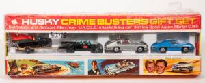 HUSKY (CORGI JUNIOR): Late 1960s Crime Busters Gift Set (3008) - Set comprising of ‘Batman's’ Batmobile and Batboat on trailer, ‘James Bond’ - Aston Martin DB5 and ‘Man from Uncle’ Car. Mint in original red and yellow cardboard windowed display box with o