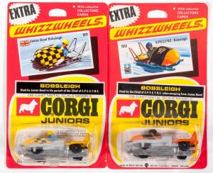 CORGI JUNIORS: Early 1970s scarce pair of ‘Whizzwheels’ James Bond Bobsleighs consisting of James Bond Bobsleigh (1011) – Yellow; and S.P.E.C.T.R.E Bobsleigh (1012) – Orange. Both mint and unopened in original yellow and red blister packs. (2 items)