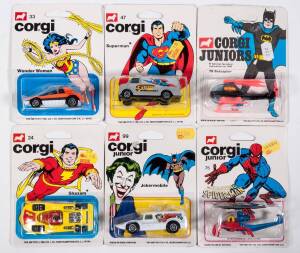 CORGI JUNIORS: Late 1970s to early 1980s group of Model Superhero and Villain Vehicles including Batman’s Bat bike (23); and, Captain America Racer (25); and, The Jokers Jokermobile (99). All mint and unopened in original white blister packs. (45 items ap