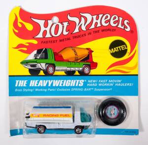 HOTWHEELS: 1971 Redline ‘Heavyweights’ Fuel Tanker (9018) – White Enamel with Blue Tinted Windows and White Plastic Pieces, also has Hotwheels Racing Fuel Sticker. Mint and unopened in original unpunched flame blister pack.