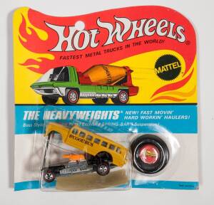 HOTWHEELS: 1971 Redline ‘Heavyweights’ S’Cool Bus (6468) – Yellow with Silver Base, also has S’Cool Bus Stickers. Mint but is opened still with its original flame blister pack. Note it appears the blister pack glue has degraded and come off and has not be