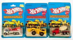HOTWHEELS: 1980s Group of &lsquo;Workhorses&rsquo; Including Phone Truck (5906) &ndash; White; And, Trash Truck (3912) &ndash; Orange; And, Construction Crane (3254) &ndash; Yellow. All mint and unopened on original cardboard blue packaging. (25 items)