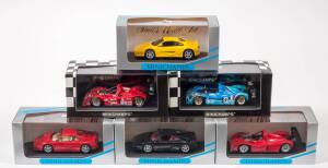MINICHAMPS: 1:43 group of Ferrari Model Cars including Ferrari 333 SP 1997 Le Mans (977604); and, Ferrari Barchetta Cabriolet Luxor Black (121932); and, 1994 Ferrari F 355 Spider (74032). All mint in original perspex display case. (27 items approx)