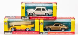 SOLIDO: Group of Model Cars including Porsche Canam (18); and, Porsche 917/10 (18b); and, BMW 2002 Turbo (28). All mint in original Red and Yellow cardboard windowed box. (6 items)