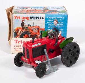 TRIANG: Rare ‘Minic’ Series II Clockwork Powered Nuffield Tractor – Red Plastic, Green Tinplate Rear Mudguard with Automatic Exhaust Smoke Device & Driver. Mint in original cardboard box with original instructions and leaflet as well as original clockwork