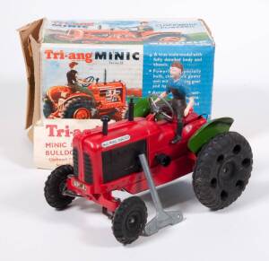 TRIANG: Rare &lsquo;Minic&rsquo; Series II Clockwork Powered Nuffield Tractor &ndash; Red Plastic, Green Tinplate Rear Mudguard with Automatic Exhaust Smoke Device & Driver. Mint in original cardboard box with original instructions and leaflet as well as original clockwork