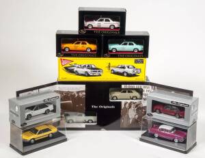 TRAX: 1:43 group of Holden Model Cars Including 50th Anniversary Set (TRS-15); and, Holden HQ Belmont Aussie Taxi Series Yellow Cab (TR17H); and, Holden 48-215 &lsquo;Golden Holden Commemorative Model&rsquo; (TRG15). All mint in original perspex display case and card