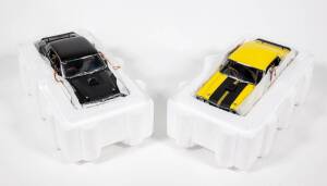 TRAX: 1:24 pair of Ford Model Cars consisting of Ford XY Falcon GTHO (TX 024) – Yellow and Black; and, Ford XY Falcon GTHO (TX 024) – Black. Both mint in original polystyrene and cardboard packaging. (2 items)