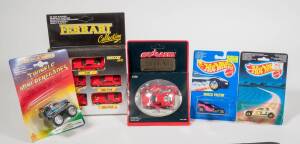 Miscellaneous group of model cars consisting of HOTWHEELS: Peugeot 205 Rallye (1469); and, ERTL: Batmobile (1064); and, MAJORETTE: 1:60 Ferrari F40. All mint in original cardboard packaging. (30 items approx.)
