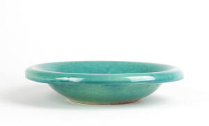 KLYTIE PATE: Pottery fruit bowl glazed in green with pink base. Incised signature. 25cm