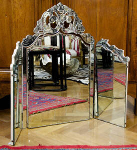 A Venetian cut glass three-fold dressing table mirror, circa 1950, 84cm high, 106cm wide 