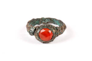 A Roman bronze ring, set with a carnelian, 2.75cm diameter