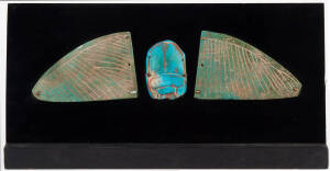 An Egyptian faience winged scarab, late period 664 to 332 BC; scarab approx. 6cm, each wing approx. 9cm wide. 