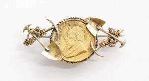 GOLD MINING BROOCH: set with a South African half pond 22ct gold coin. 6+ grams