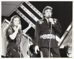 JOHNNY CASH, b/w photograph signed by Johnny cash & his wife June Carter Cash; together with issue No.1 of "Johnny Cash - the Man in Black" & tickets (2). Also b/w photograph signed by The Osmond Brothers.