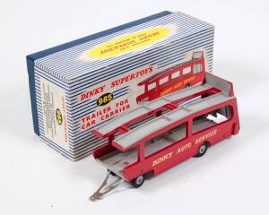 DINKY: Early 1960s ‘Dinky Auto Service’ Trailer for Car Carrier (985) - Red Body, Grey Ramps with Grey Supertoy Hubs. Mint in original blue and white striped lift off box. Slight damage to the lift off box, missing inner packing peices.