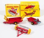 DINKY: Late 1950s to Early 1960s Group of Farm Equipment Including Harvest Trailer (320) – Red, Yellow Raves and Yellow Plastic Hubs; And, Massey-Harris Manure Spreader (321) – Red with Yellow Plastic Hubs; And, Hay Rake (324) – Red with Yellow Metal Whee