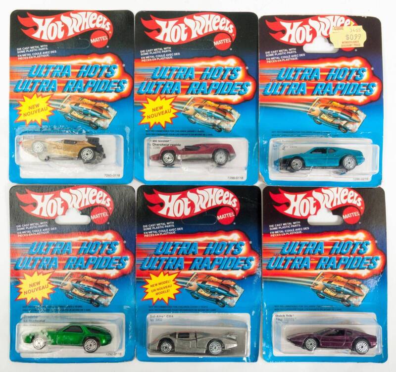 HOTWHEELS: 1980s Group of Ultra Hots Including Speed Seeker (7299); And, Wind Splitter (7296); And, Flame Runner (7293). All mint and unopened on original cardboard cards. (17 items)