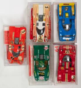 SUPER CHAMPION: 1:43 Group of Model Racing Cars Including Porsche 917 (54) – Orange; And, Ferrari 512M N.A.R.T (64) – Red; And, Porsche 917 (41) White. All mint in original perspex display case. (5 items) 