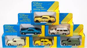 TRAX: 1:43 1980s ‘8000 Series’ Group of Holden Model Cars Including FJ Holden Van (8003) – Blue ‘Wine and Spirit Marchant’; And, Holden Monaro HK GTS (8004) – Red; And, EH Holden Station Wagon (8011) – Dark Brown with White Roof. All mint in two tone yell