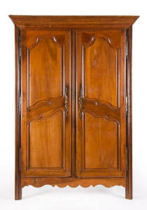19th century French walnut and oak armoire with carved paneled doors.110cm x 146cm x 69cm