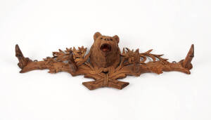 A carved wood bear form coat rack, Swiss or German 19th century