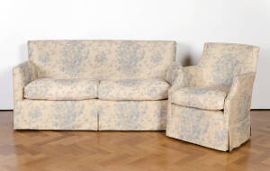 An upholstered sofa and armchair covered in blue rose pattern fabric, sofa: 84cm high, 168cm wide , chair: 85cm high