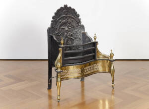 A large brass and cast iron fire basket