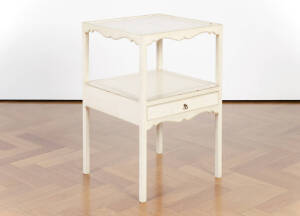 A Georgian style cream painted two tier bedside table