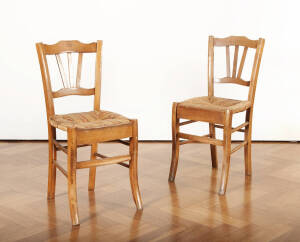 A set of four rush seated farmhouse kitchen chairs