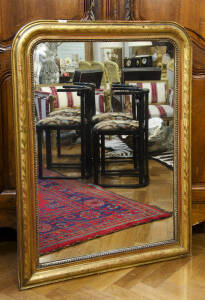 19th Century gilt framed over mantle mirror. Frame decorated with floral motif.&nbsp;