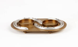 A brass and silver-plated desk stand in the form of horse shoes by Hermes, French circa 1920