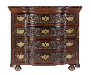 An antique continental walnut 4 door chest. Impressive floral carved drawer fronts and edge with brass swing handles. &nbsp;96cm x 65cm x&nbsp;85cm.&nbsp;&nbsp;&nbsp;