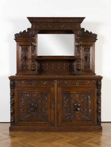 SIDEBOARD: English oak mirror backed sideboard adorned with carved knights, early 20th century. Width 167cm, Height 207cm&nbsp;