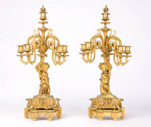 Pair of 5 branch gilt bronze candelabra with cherub bases. 60cm