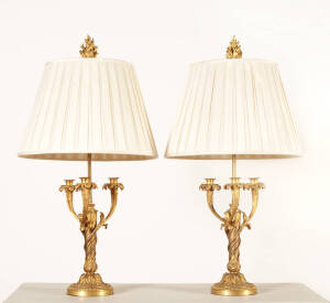 A pair of gilt metal ornate table lamps. 3 Branch candelabra form with flame finials. 90cm