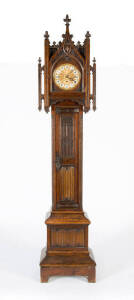 GRANDFATHER CLOCK: Pugin Gothic ornately carved oak case with linen fold front. Triple weight. Height 259cm