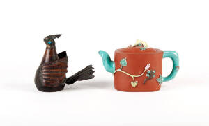 An enameled terracotta naturalistic Yixing teapot and cover 12cm high and a Tibetan jewelled copper bird 13cm high