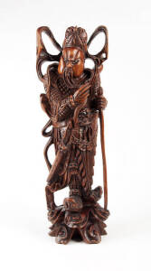A large Chinese carved wood figure of a warrior with glass inset eyes, circa 1900
