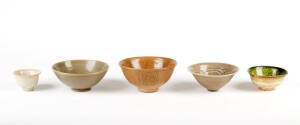 A Northern celadon carved circular bowl, Song Dynasty,&nbsp;12cm diameter and four other various glazed bowls 7 to 13cm diameter