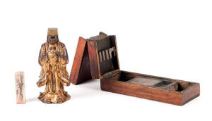 A Chinese ink stone in case 23cm long, a gilt lacquered wood figure of an official 18cm high and a carved stone seal with inscription 7.5cm high