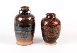 A large Henan brown and black glazed vase, 21cm high and a smaller ovoid vase, 17cm high