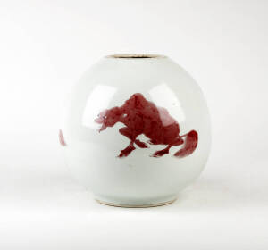 A Chinese underglazed red painted bottle vase, painted with three animals, 22cm high&nbsp;