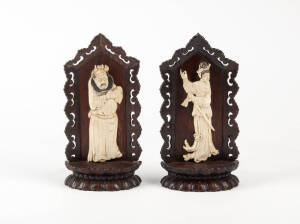 A pair of carved figures of a man and a woman on carved wood stands, 19th century 19cm high