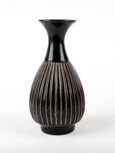 A Chinese brown glazed ribbed ovoid vase in the Song style, 26cm high