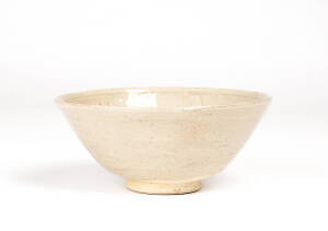A Celadon Bowl, Yuan Dynasty (960-1279), with carved design of leaves beneath a rich olive glaze, diameter 17cm, Provenance: Christies London June 1986, Lot 177