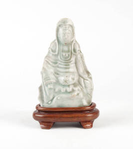 A celadon glazed figure of seated Guanyin